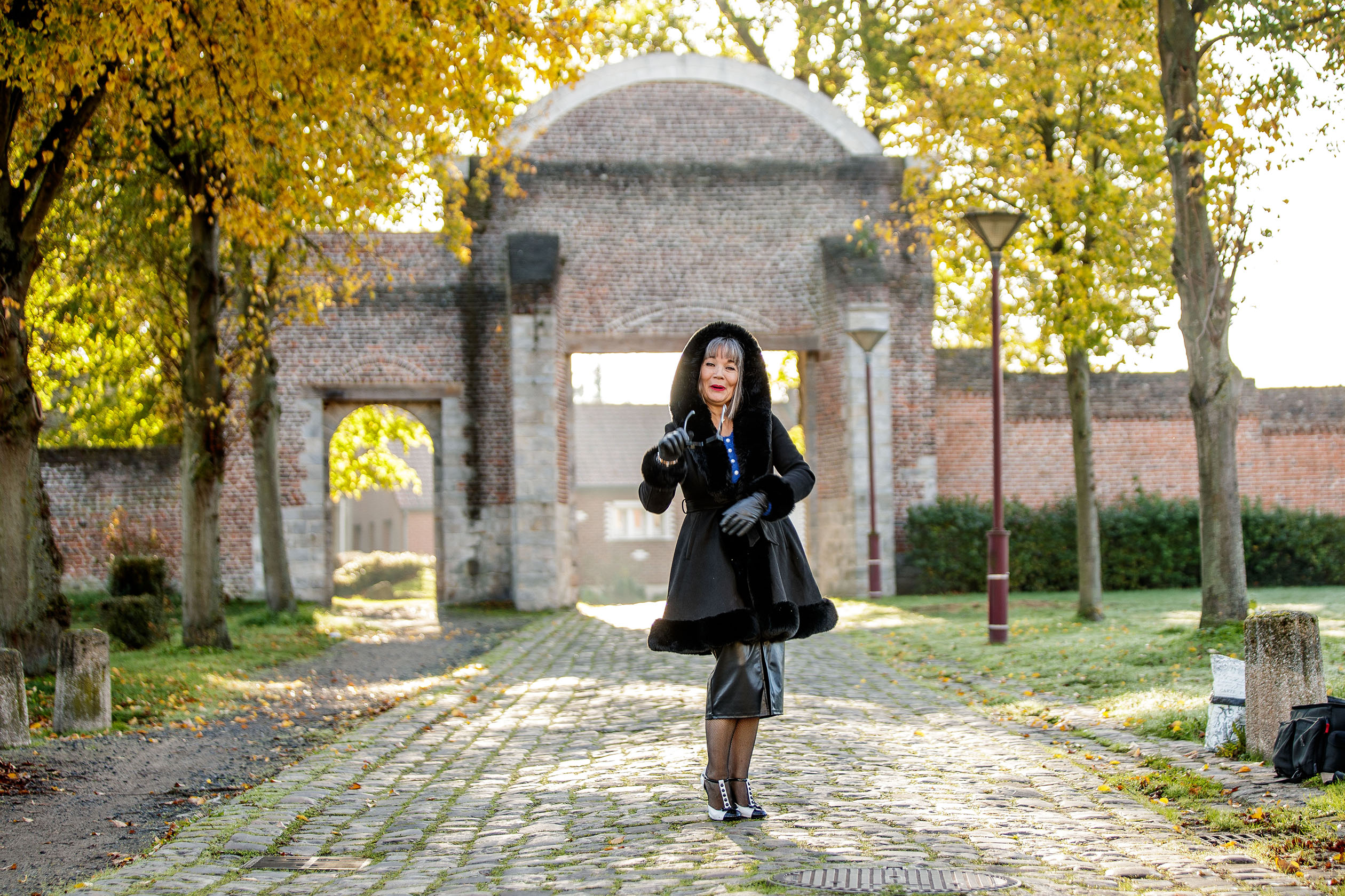 a woman in a black coat
